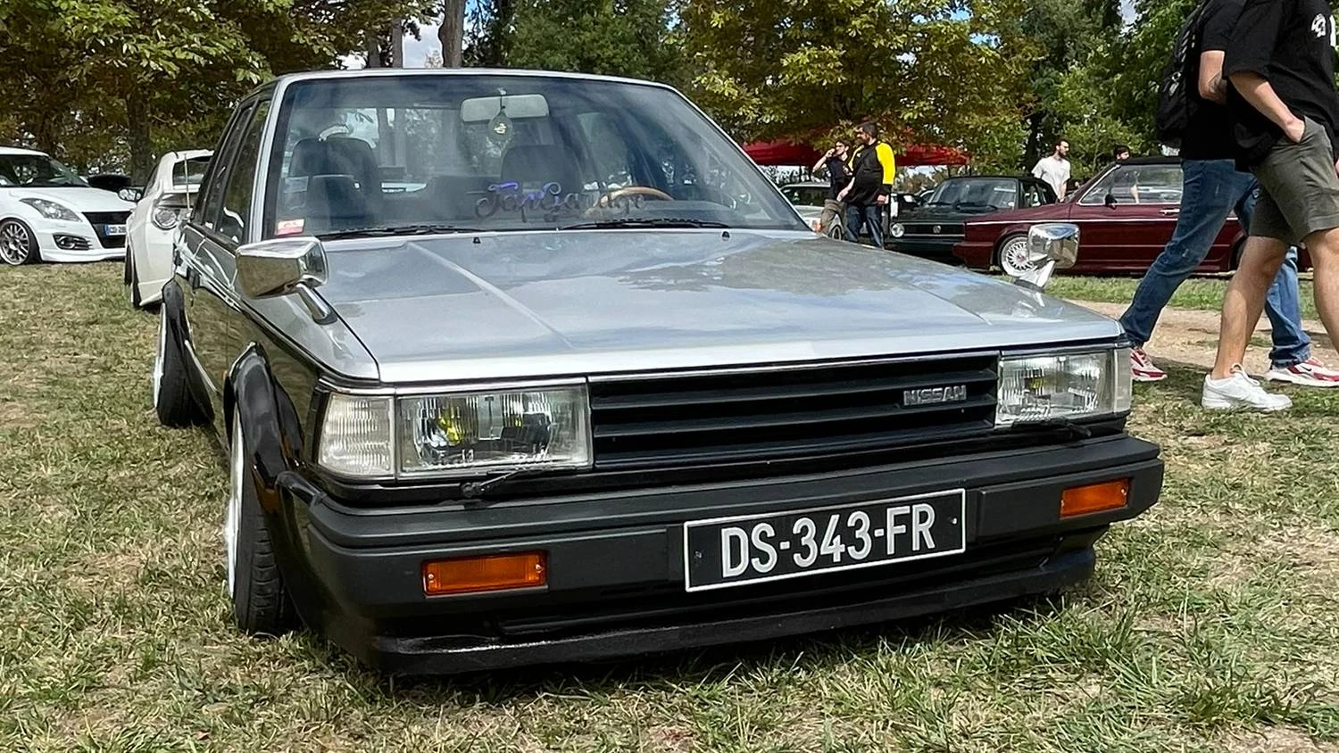 Front end view of a grey/black 1984 Nissan Bluebird