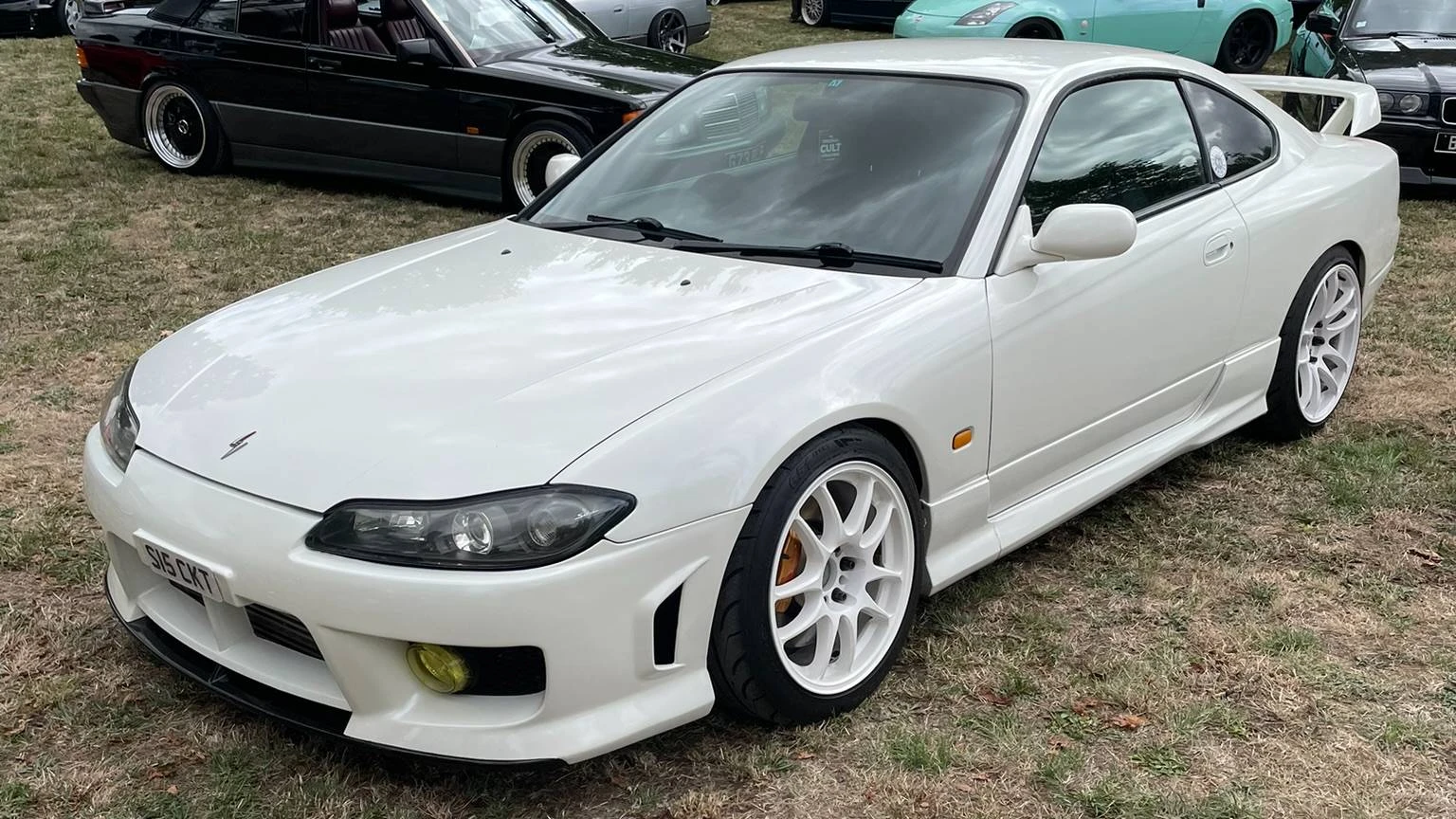 A stanced white Nissan Silvia S15