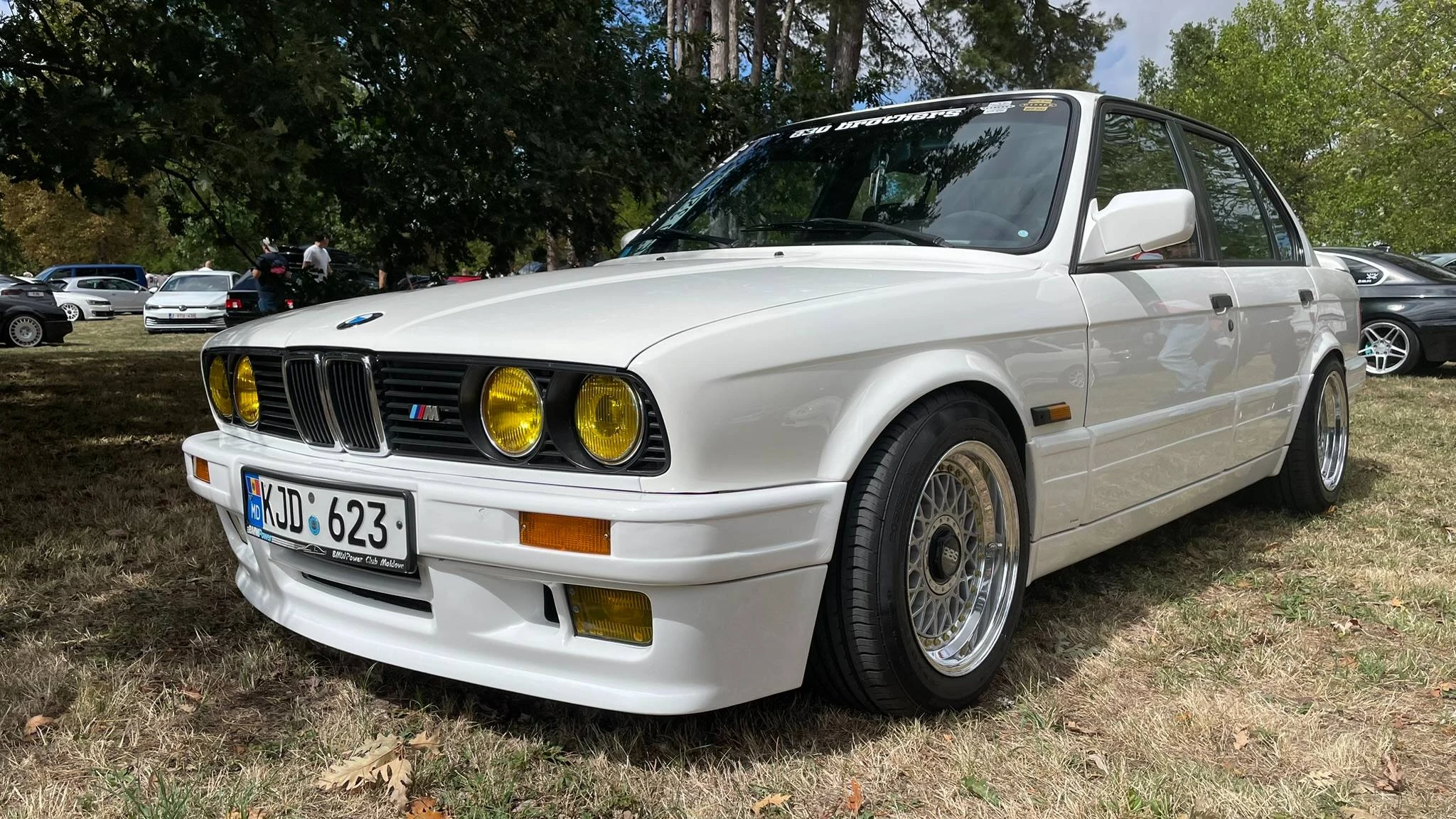 A stanced white BMW E30