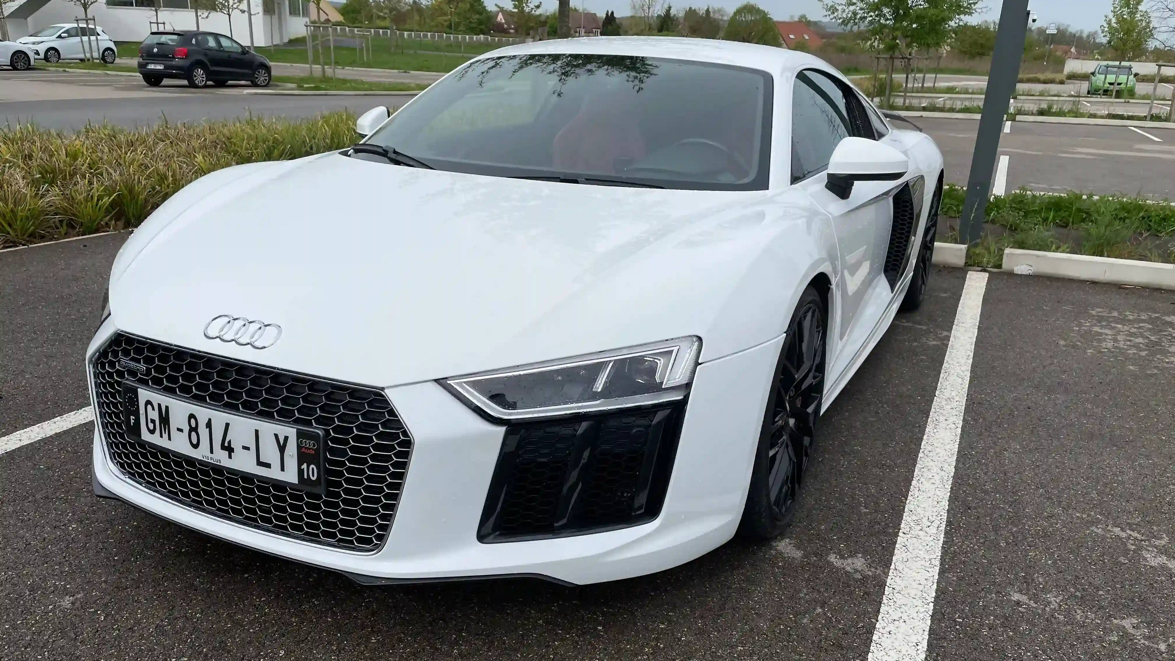 A parked white Audi R8 V10 Plus