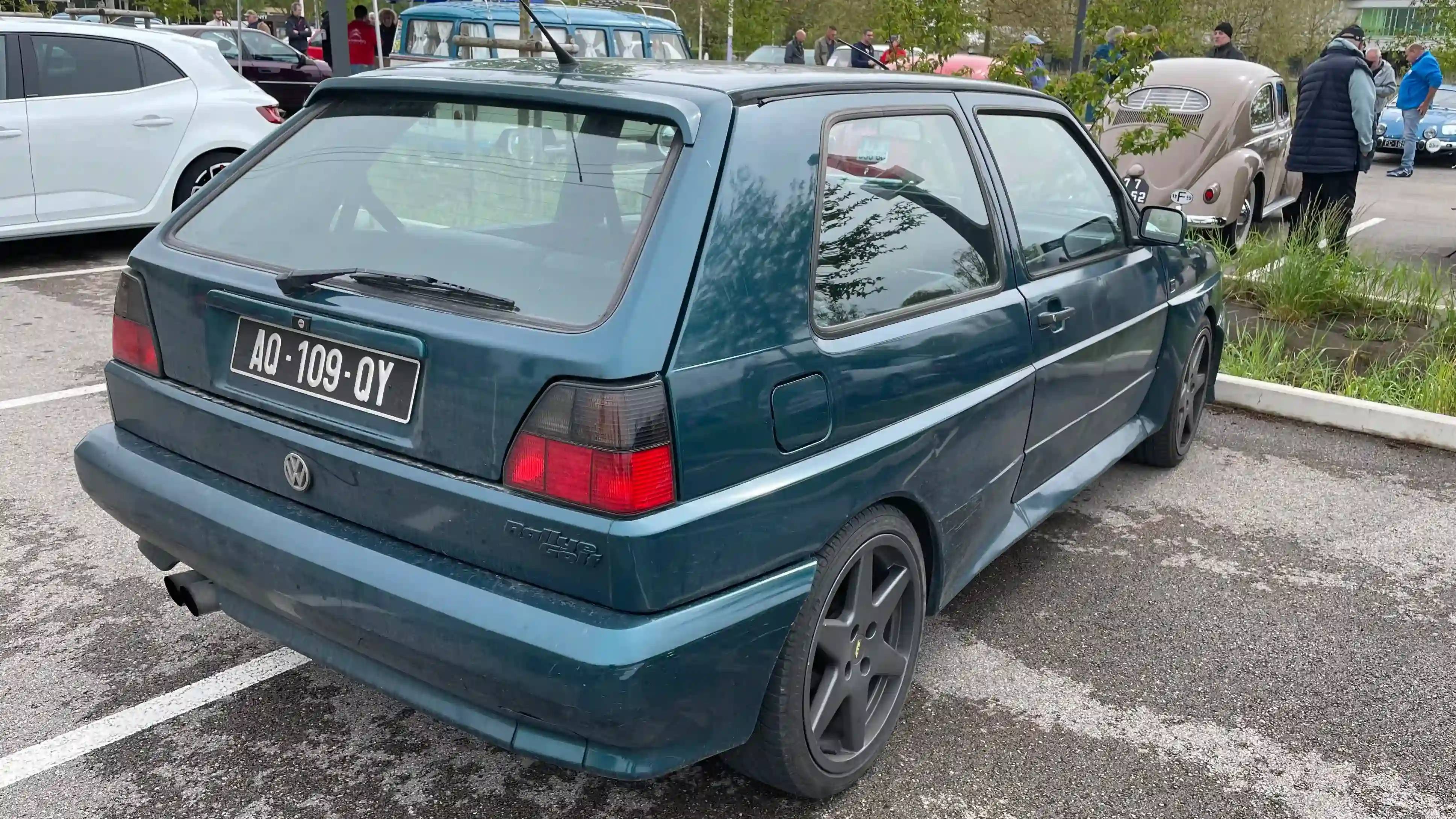 A parked dark teal Volkswagen Golf Rallye