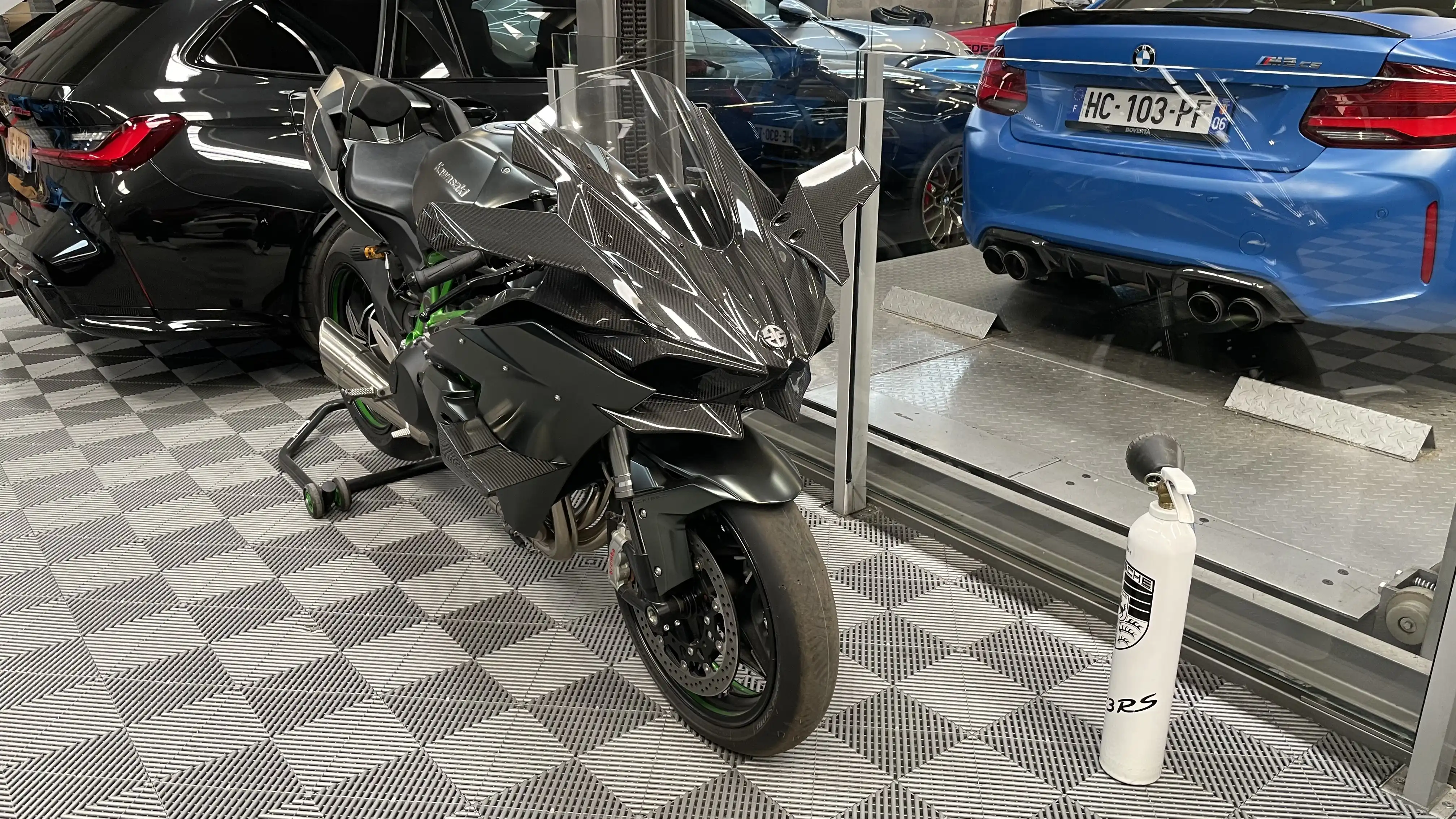 A black Kawasaki Ninja H2R 326 inside the showroom of Dream Car Performance